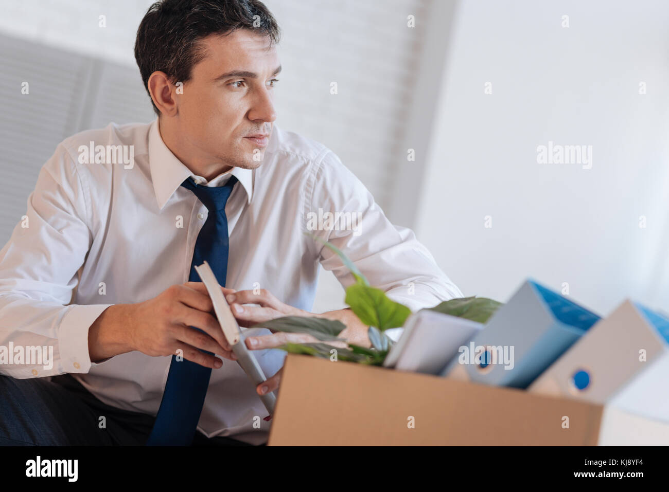 Thoughtful calm man considering his future after being dismissed Stock Photo