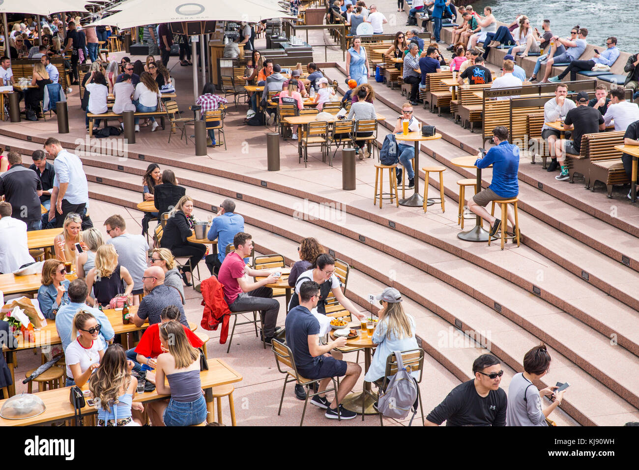 People with friends having a drink at the Sydney Opera bar Circular Quay,Sydney,Australia Stock Photo