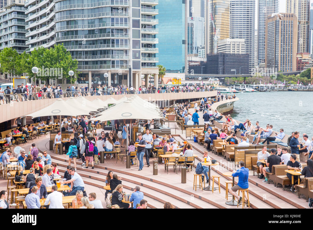 People enjoying food and drink at the Opera Bar at circular quay in Sydney,Australia Stock Photo