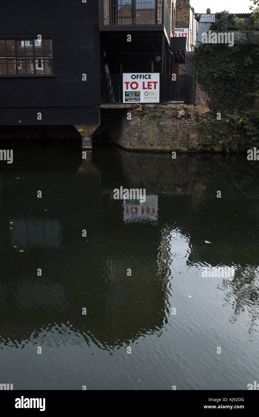 To Let sign on canal side commercial property Stock Photo