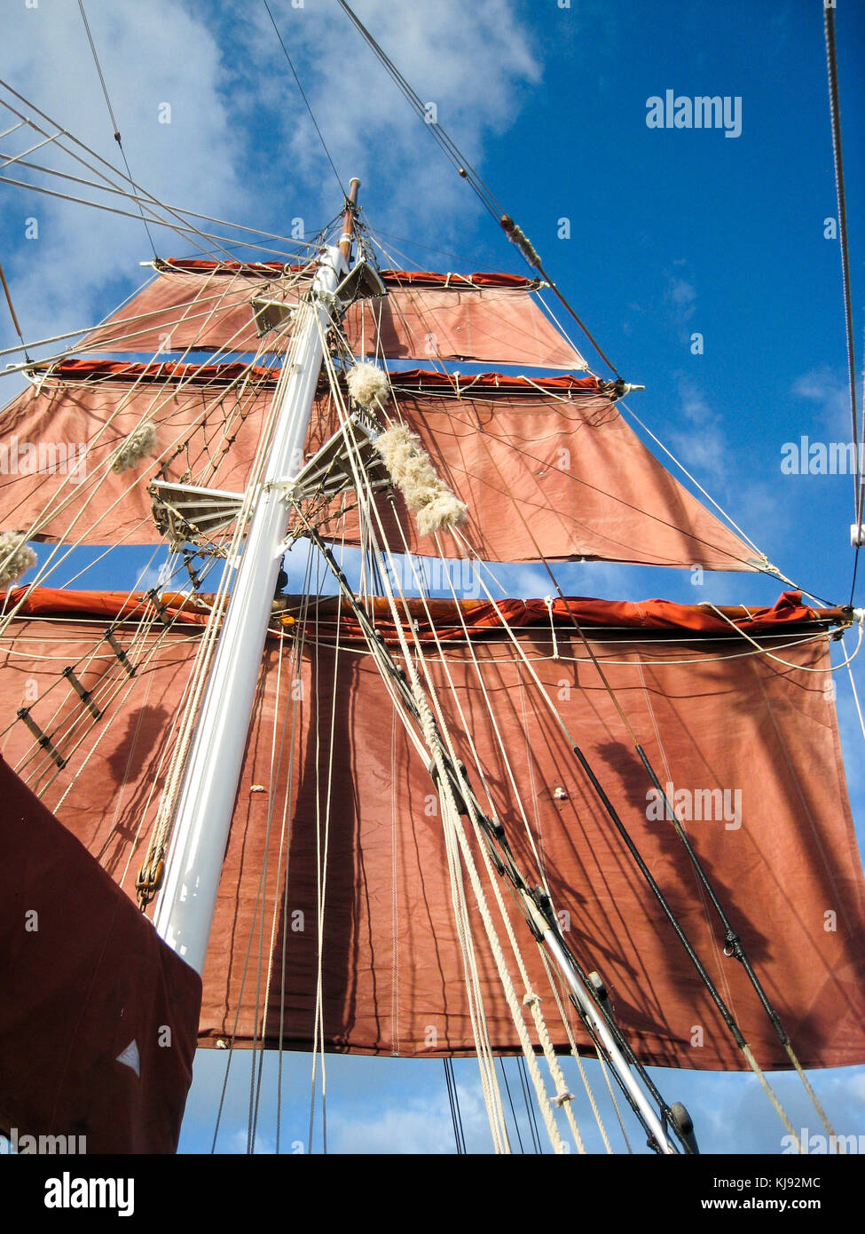 Looking up at the mast of a tea clipper on a clear sunny day Stock Photo