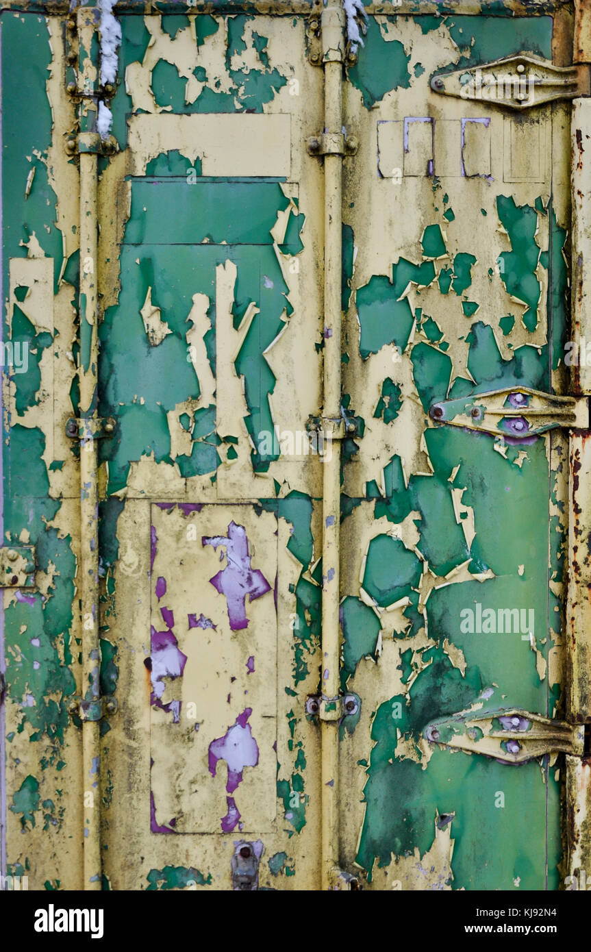 Flaking paint on the door of an old shipping container Stock Photo