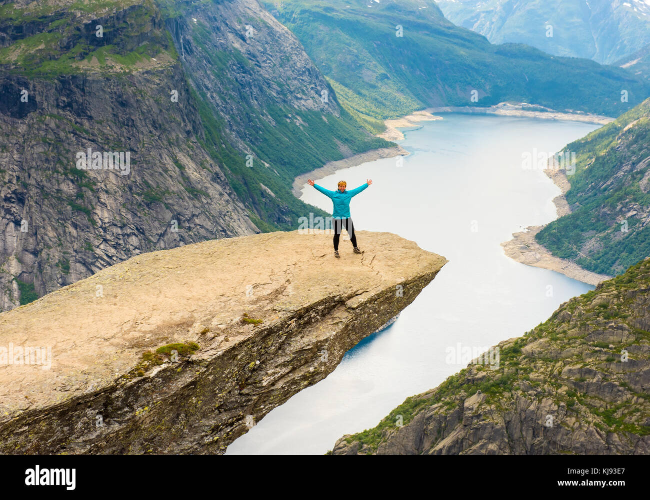 Sporty woman posing on Trolltunga Norway Stock Photo