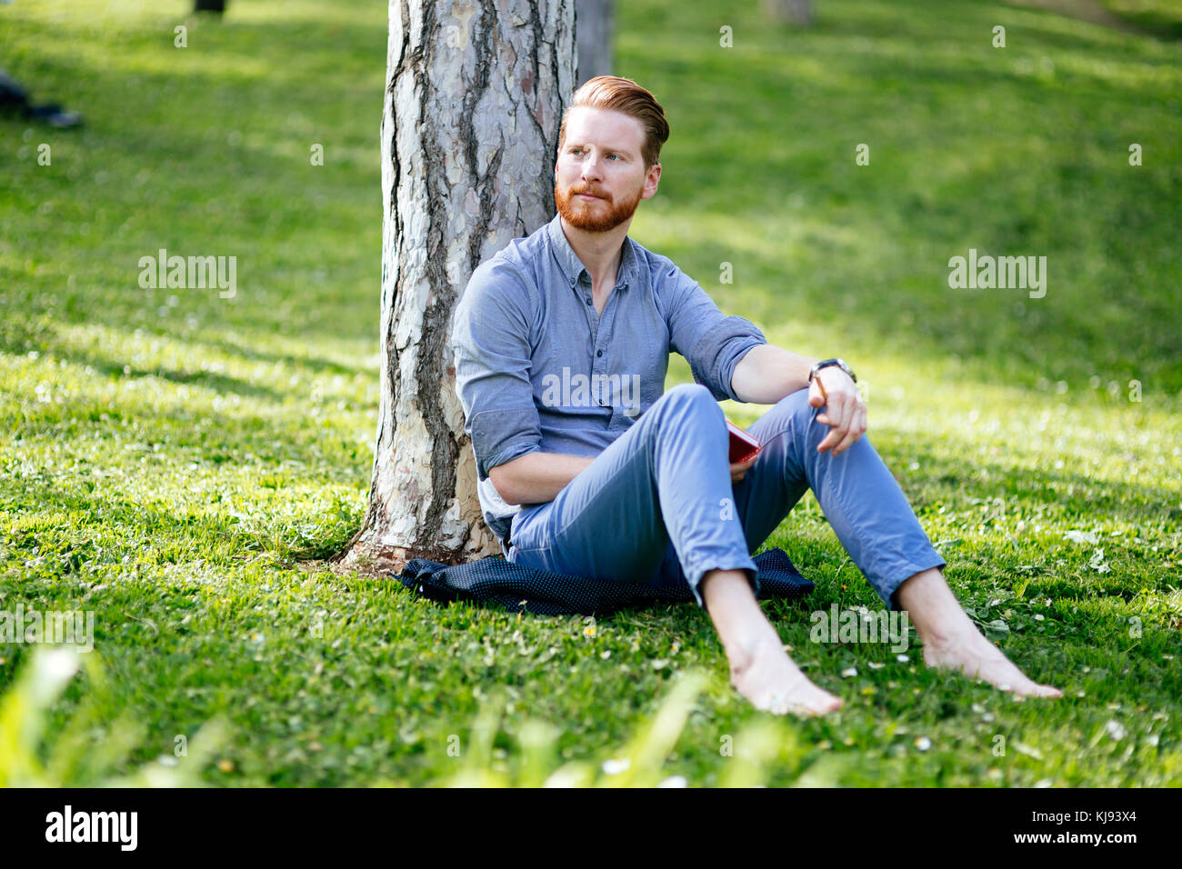 College student studying in park Stock Photo - Alamy