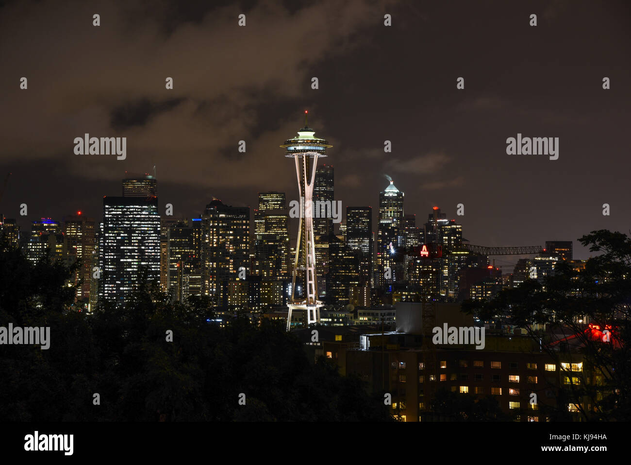 Evening dusk city scape of Seattle skyline Space Needle at night with lights Stock Photo