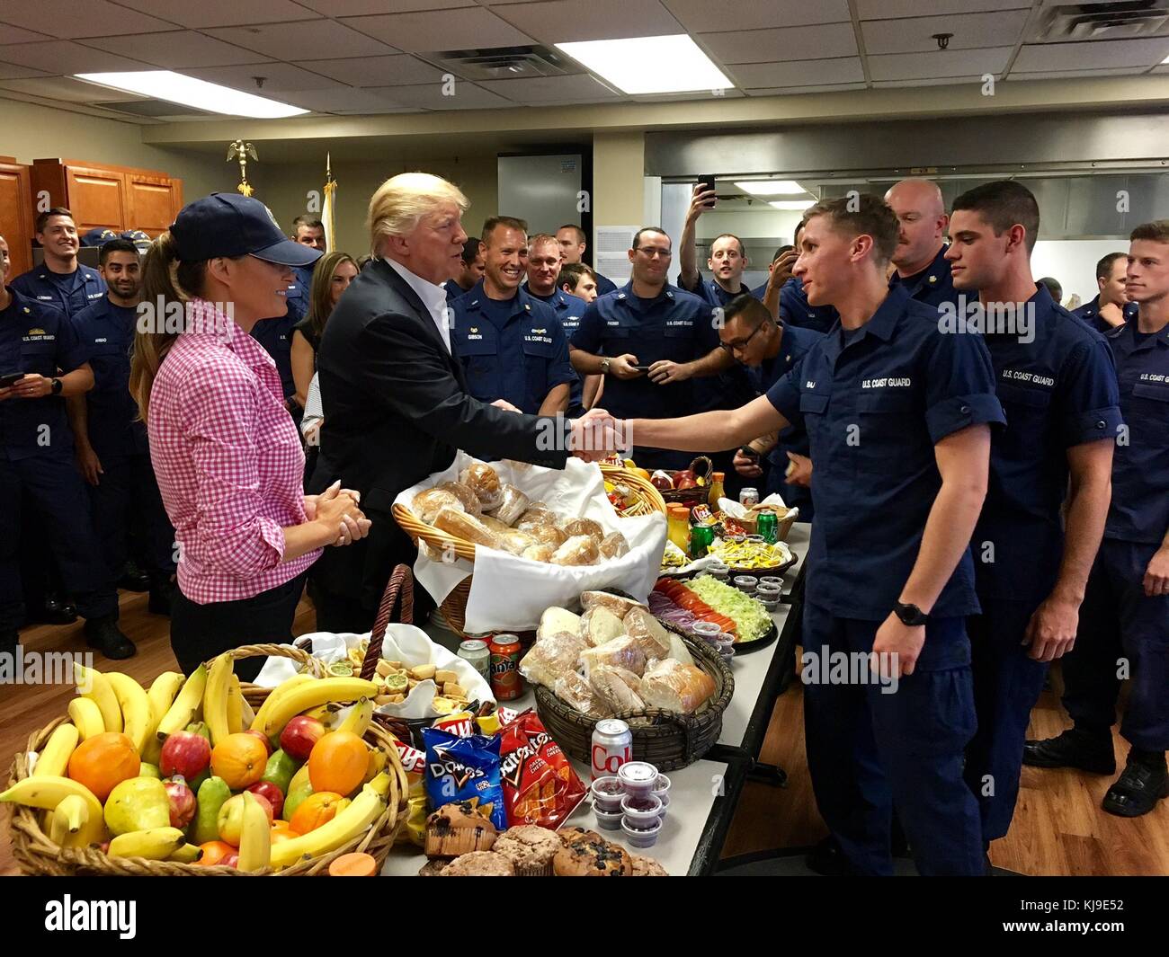 Coast Guard Station, Riviera Beach, Florida, USA. 23rd Nov, 2017. U.S. President Donald Trump and First Lady Melania Trump greet Coast Guardsmen as they serve lunch on Thanksgiving Day during a visit to the U.S. Coast Guard Station Lake Worth Inlet November 23, 2017 in Riviera Beach, Florida. Credit: Planetpix/Alamy Live News Stock Photo