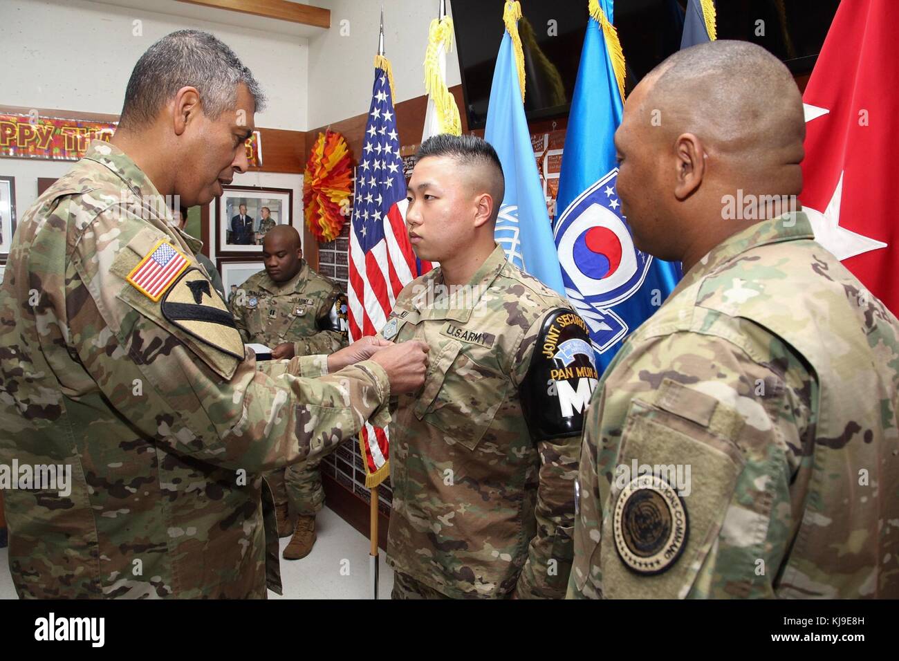 Paju, South Korea. 23rd November, 2017. U.S. Army Gen. Vincent Brooks, U.S. and U.N. Forces Korea commander, left, presents the Army Commendation medal to U.S. and South Korean soldiers during a Thanksgiving Day ceremony at Camp Bonifas on the Demilitarized Zone November 23, 2017 in Paju, South Korea. The soldiers were recognition for their efforts in rescuing a North Korean defector on November 13th. Credit: Planetpix/Alamy Live News Stock Photo