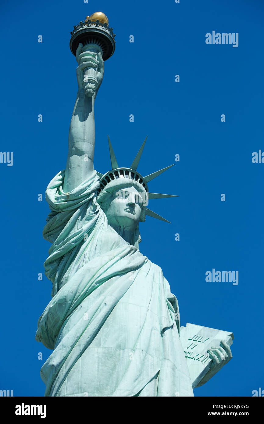 Statue of Liberty in a sunny day, blue sky in New York Stock Photo