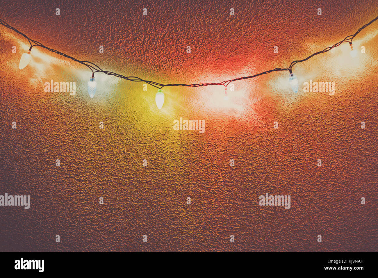 fancy christmas party lights hanging on the wall Stock Photo