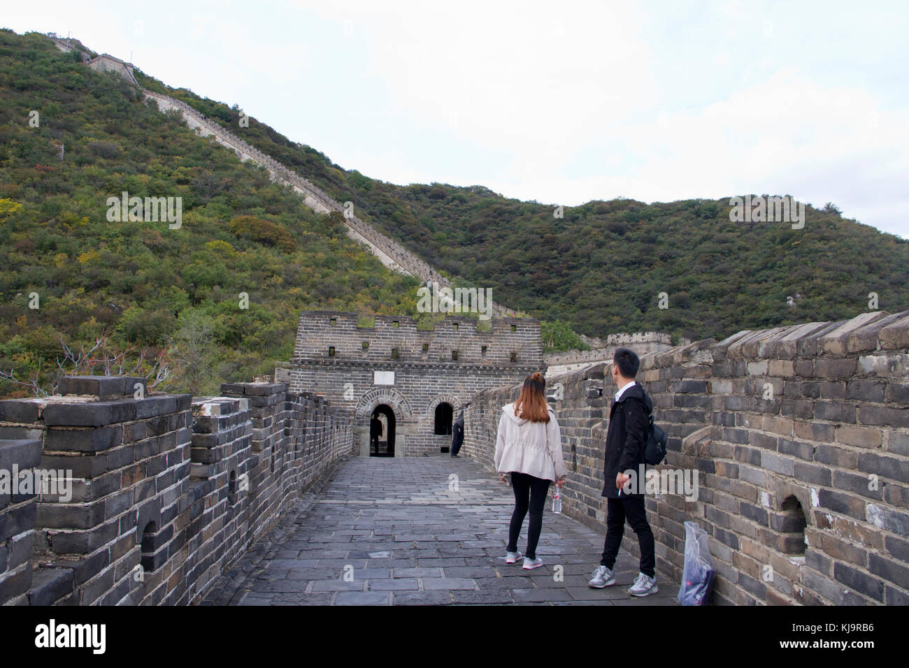 People walk on the Mutianyu section of the Great Wall of China in