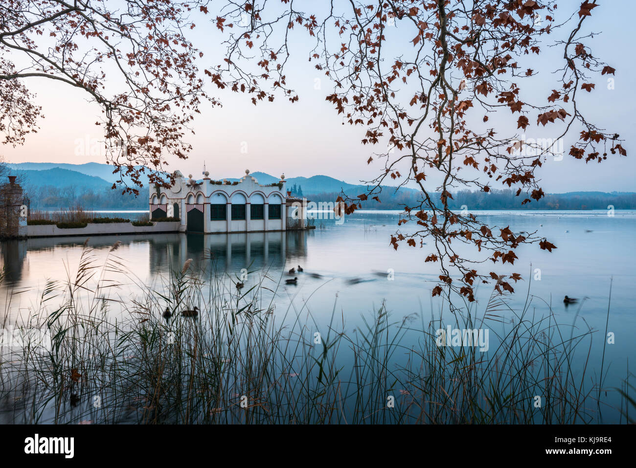 Typical building in the lake of Banyoles during a sunset Stock Photo