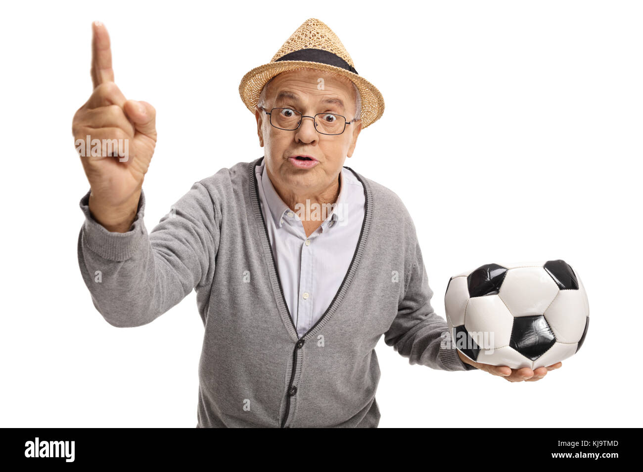 Angry senior with a deflated football arguing and gesturing with his finger isolated on white background Stock Photo