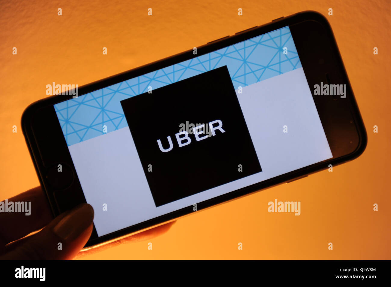 The Uber logo seen on a phone Stock Photo