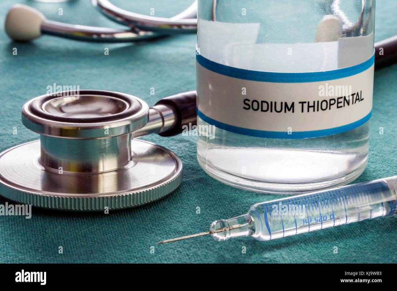 Vial with Sodium Thiopental next to stethoscope and syringe in a hospital, conceptual image Stock Photo