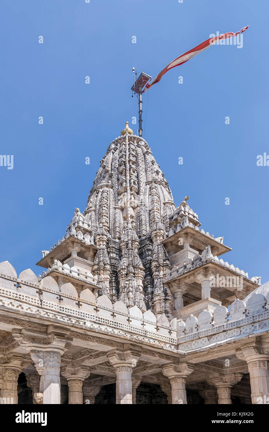 Waving flag on top of the Ranakpur Jain Temple, Rajasthan, India Stock Photo