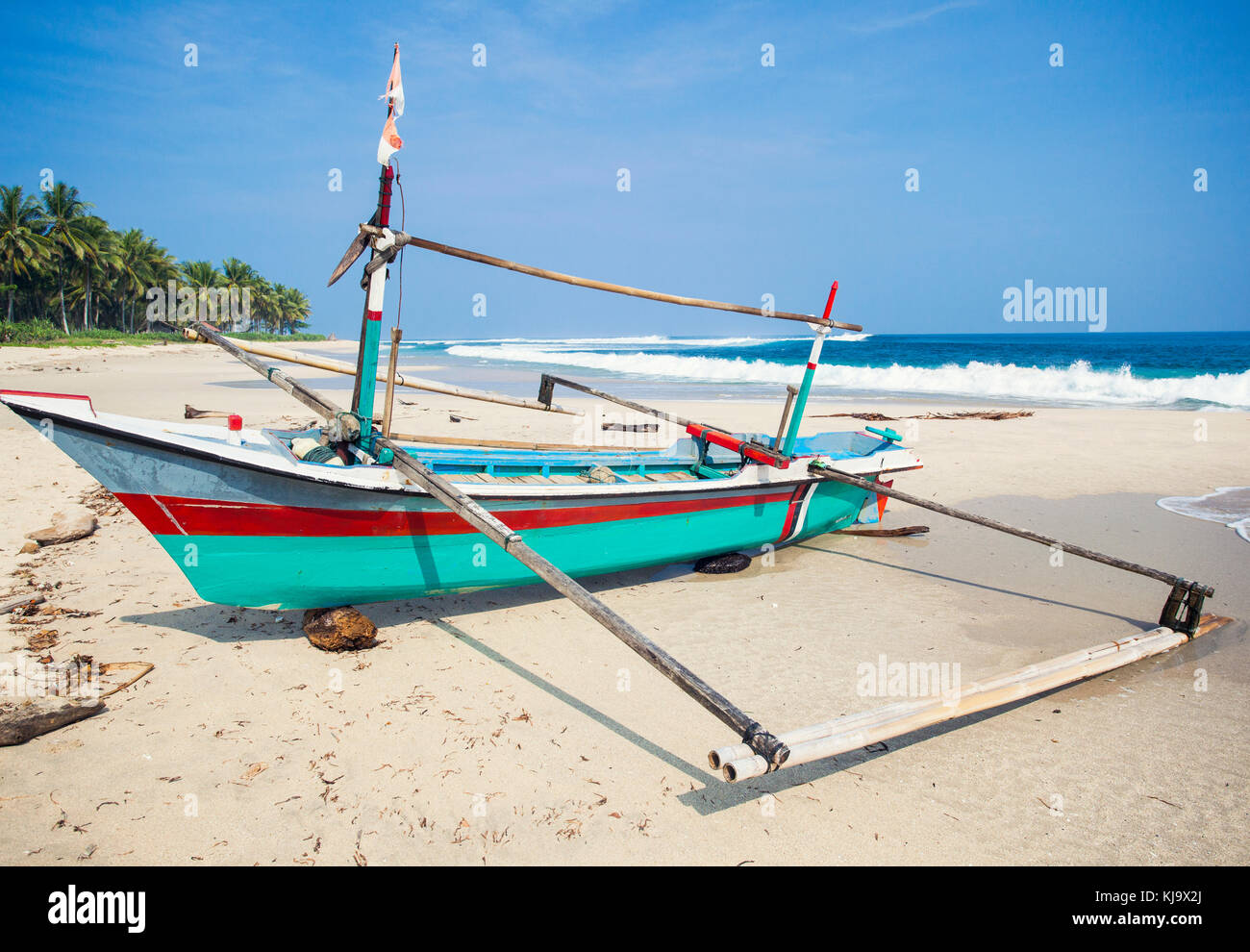 Beautiful landscape of a boat on a beach from Indonésia Stock Photo