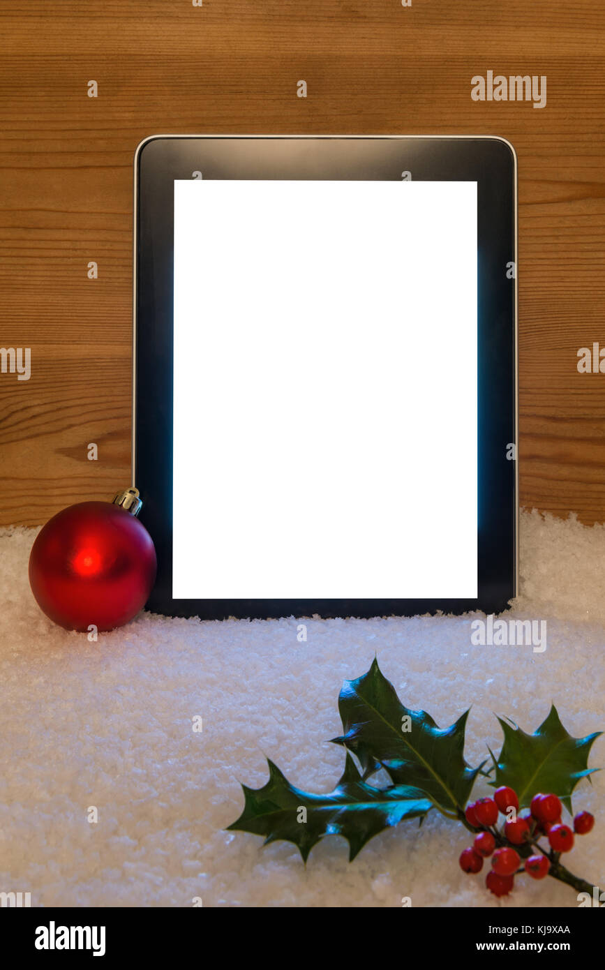 A Christmas still life with blank tablet screen and clipping path to add your own message. Stock Photo