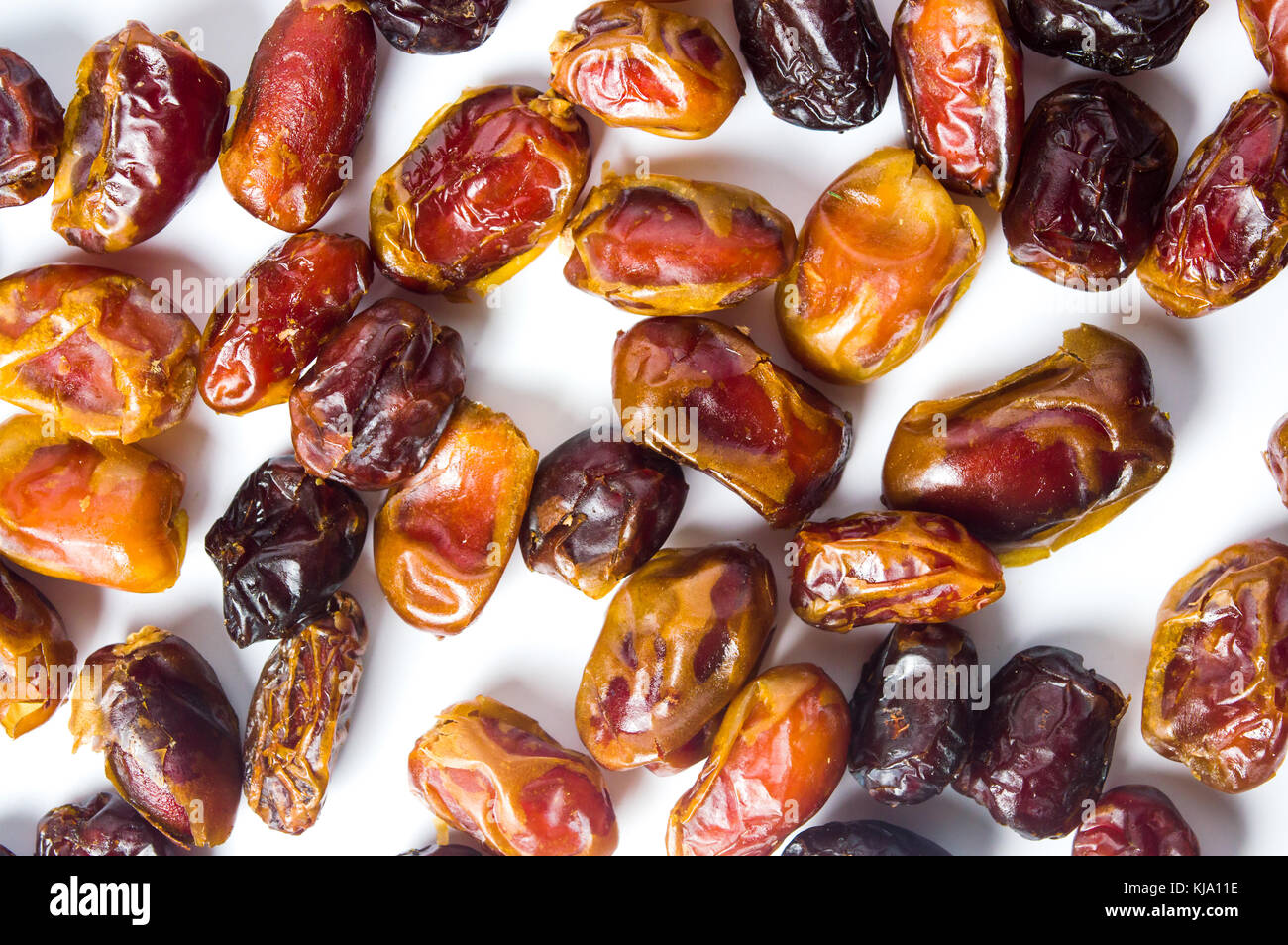Fresh arabian dates isolated on white background Stock Photo - Alamy