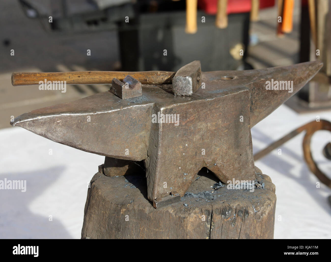 anvil and heavy hammer in the of blacksmith Stock Photo Alamy