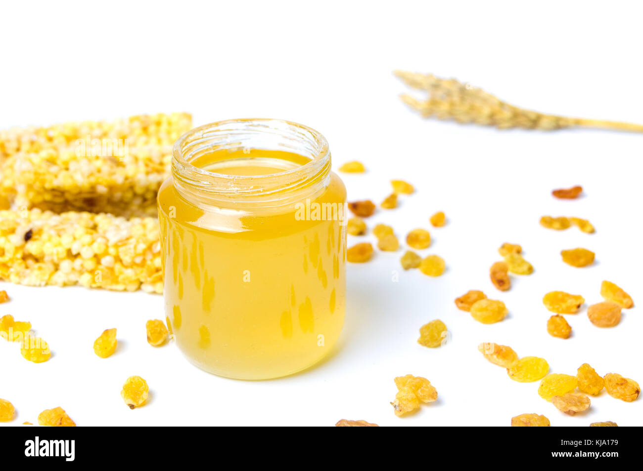 Honey jar with corn fruit dessert bars isolated Stock Photo Alamy