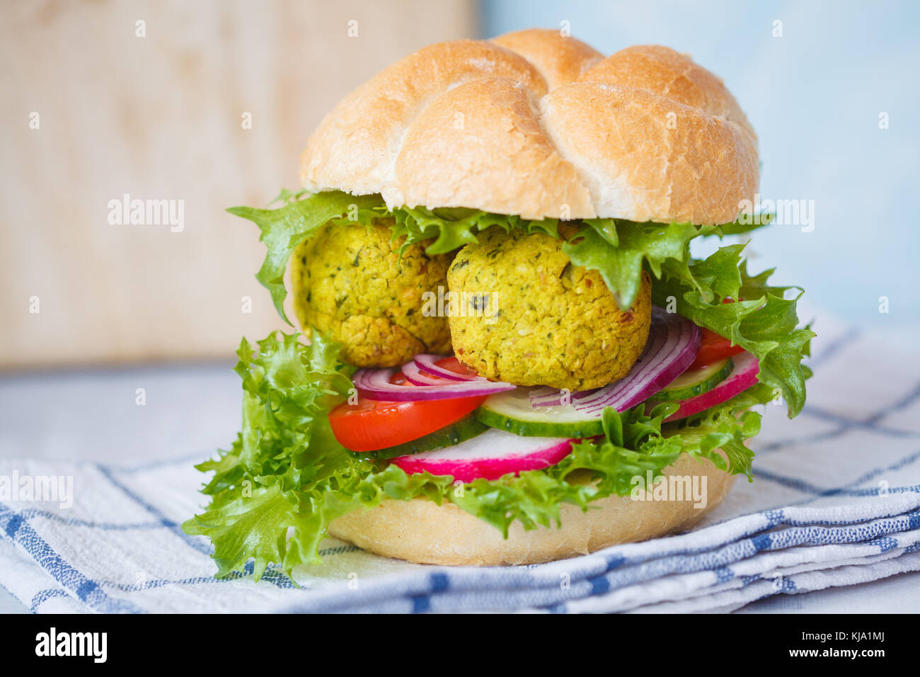Vegan falafel burger with vegetables. Vegan Healthy Food Concept. Stock Photo