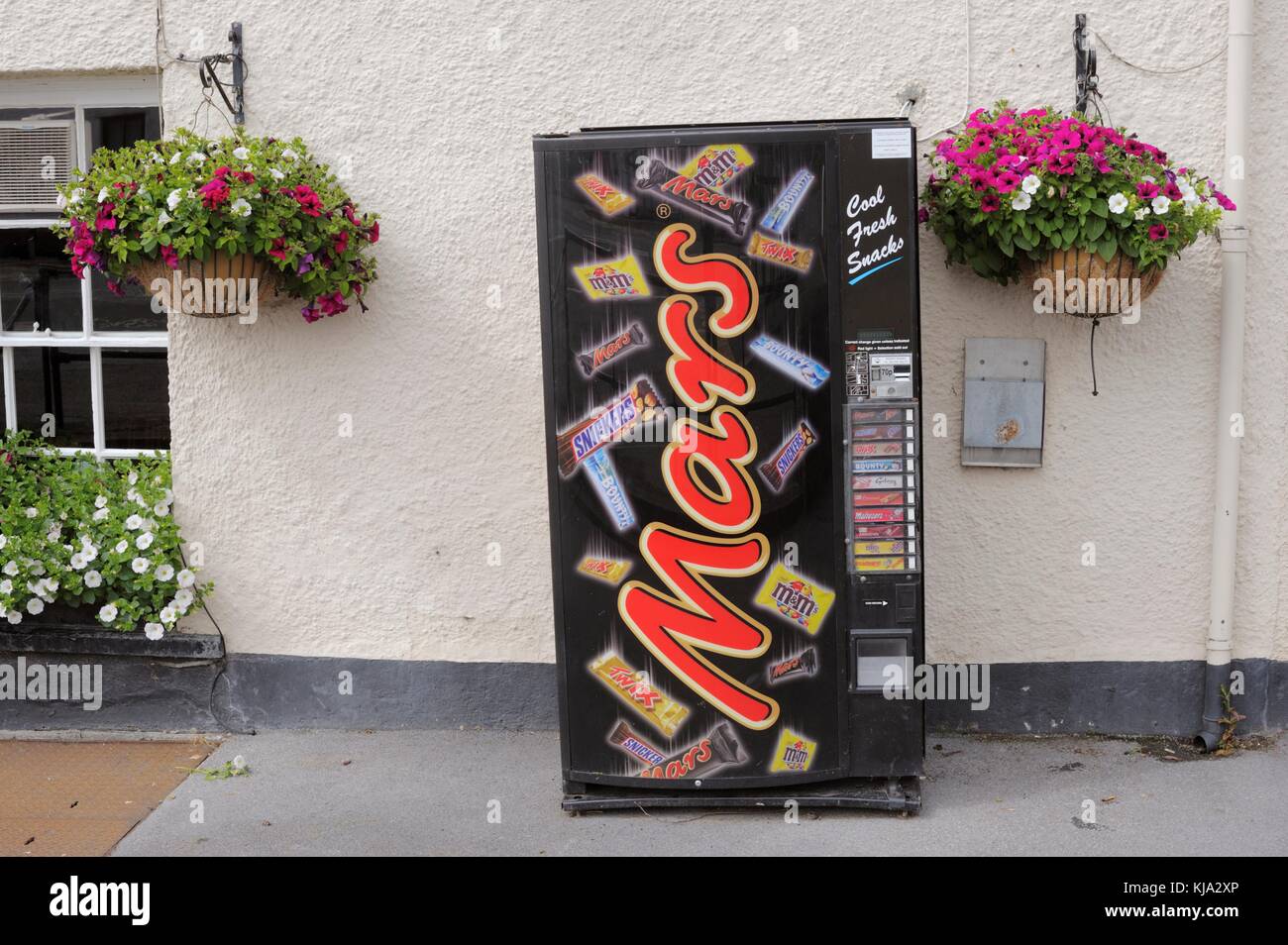 Chocolate vending machine outtside a public house, Wales, UK Stock