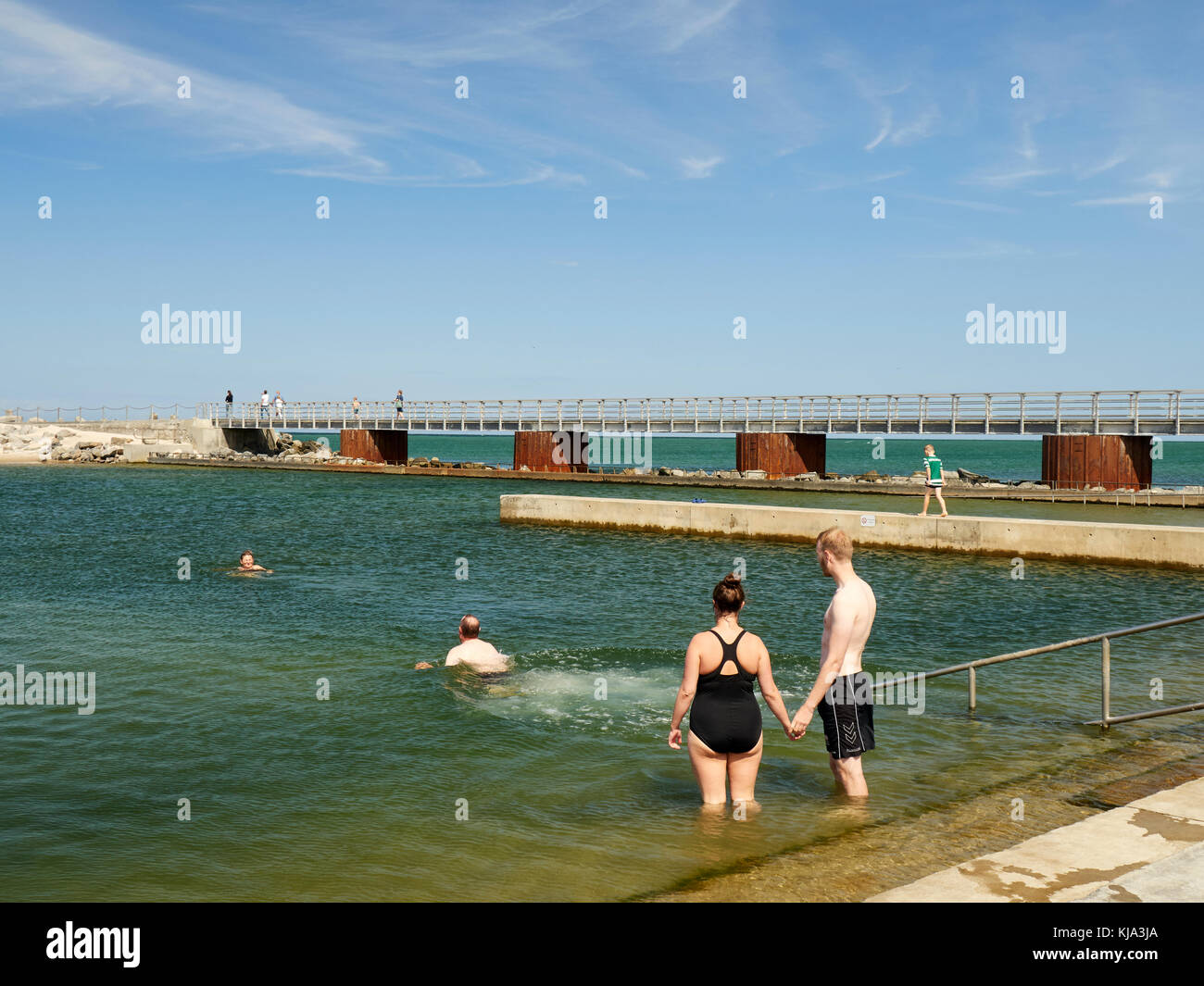 People swimming in the open salt water pool, Nr. Vorupør, Denmark Stock ...