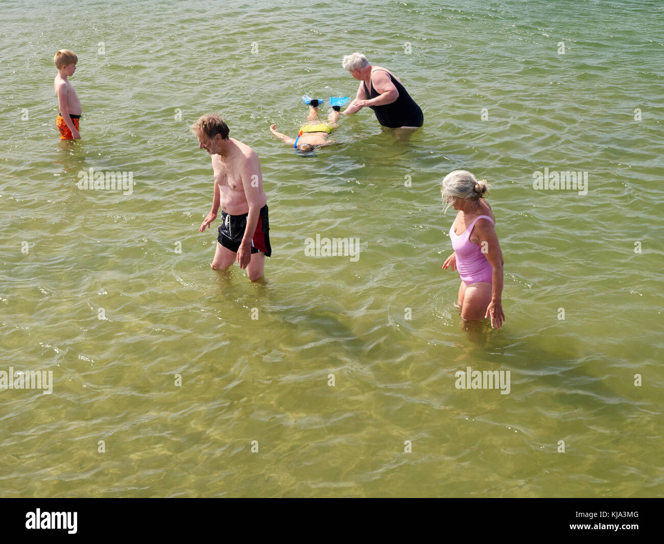 People in the open salt water pool, Nr. Vorupør, Denmark Stock Photo