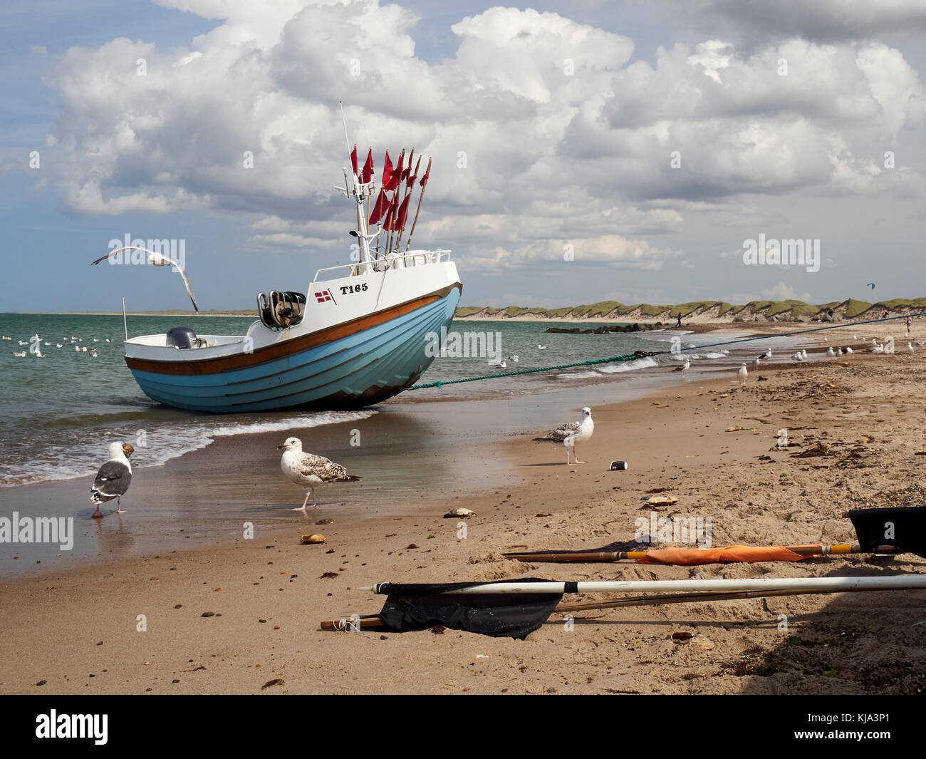 Fishingboat beeing hauled ashore, Nr. Vorupør, Denmark Stock Photo