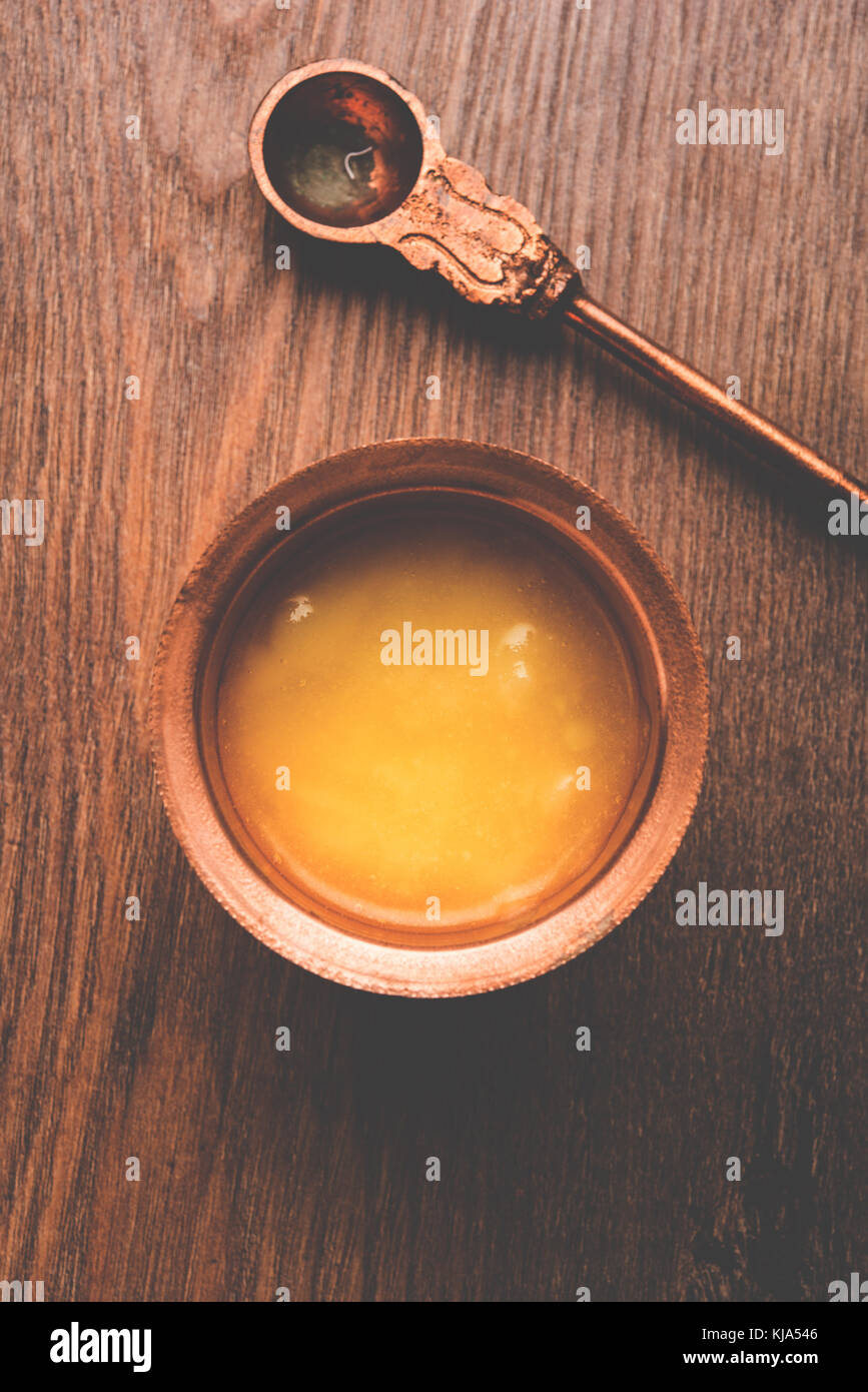 Desi Ghee or clarified butter in glass or Copper container or ceramic
