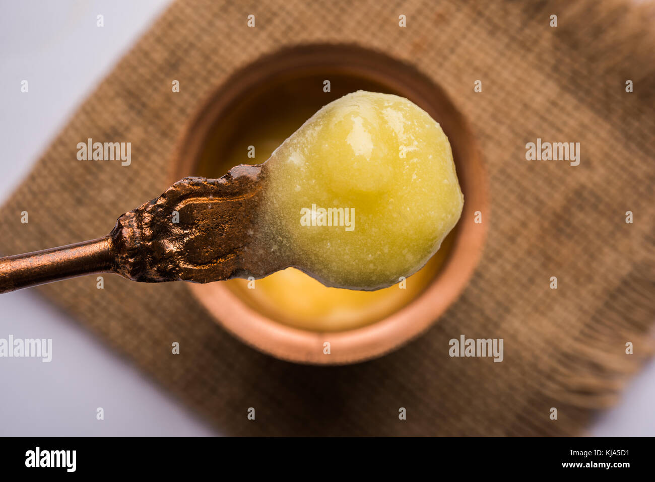 Desi Ghee or clarified butter in glass or Copper container or ceramic