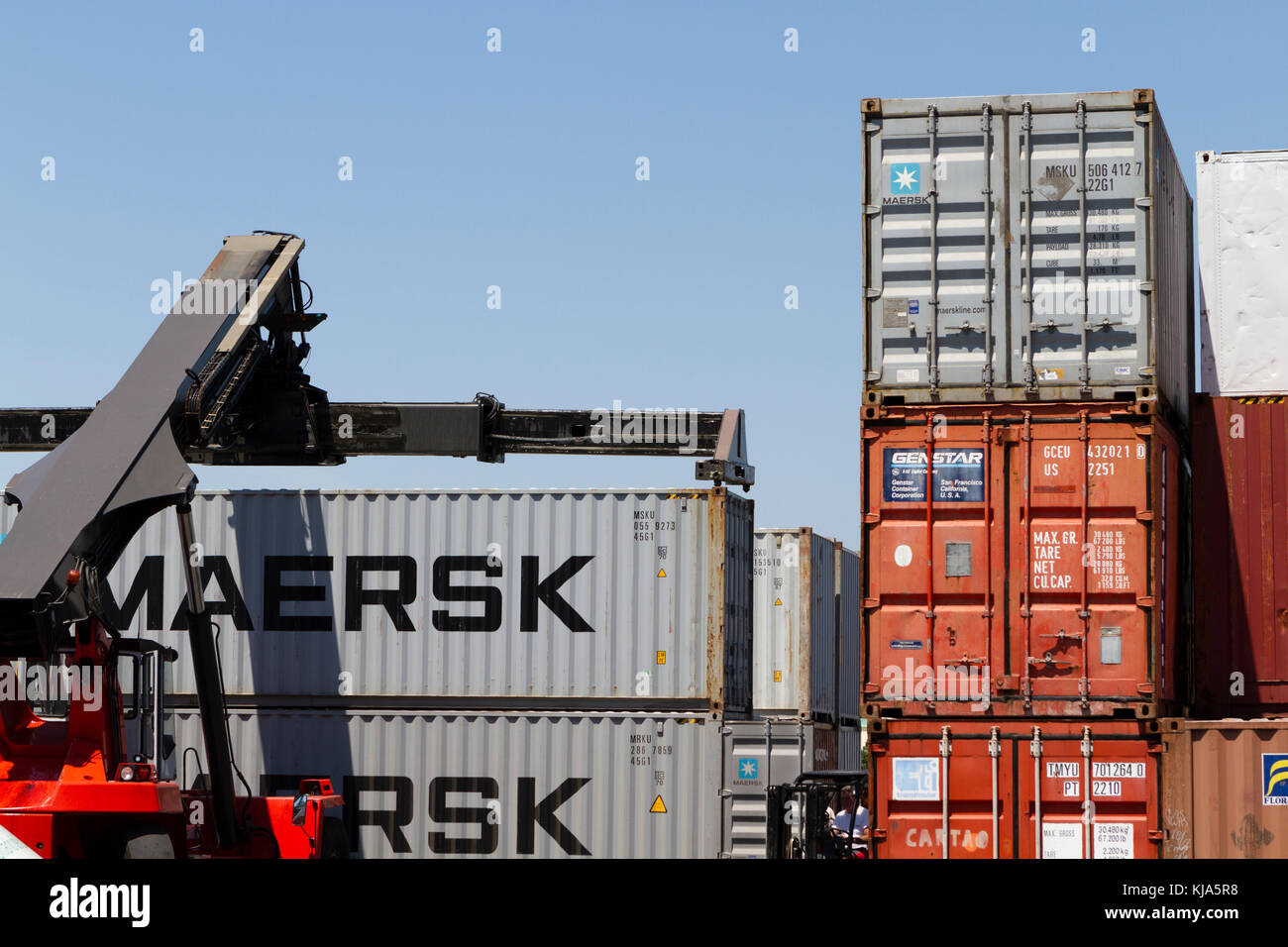Lift truck pick up shipping container Stock Photo Alamy