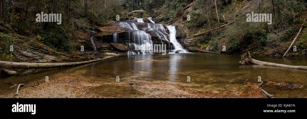 Panther Creek Falls is one of the larger as well as most beautiful waterfalls in northern Georgia.  They are approximately 50 feet high but are probably 80-100 feet wide.  The eastern trailhead to Panther Creek Falls begins on Historic 441 at the Panther Creek Picnic are in Clarkesville, Georgia.  The hike is over 3 miles to the falls, and while generally easy does have some areas that require some agility as you are making your way along cliff walls high above the stream.  The trail generally follows Big Panther Creek, and crosses it via a foot bridge at roughly the half-way point in the hike Stock Photo
