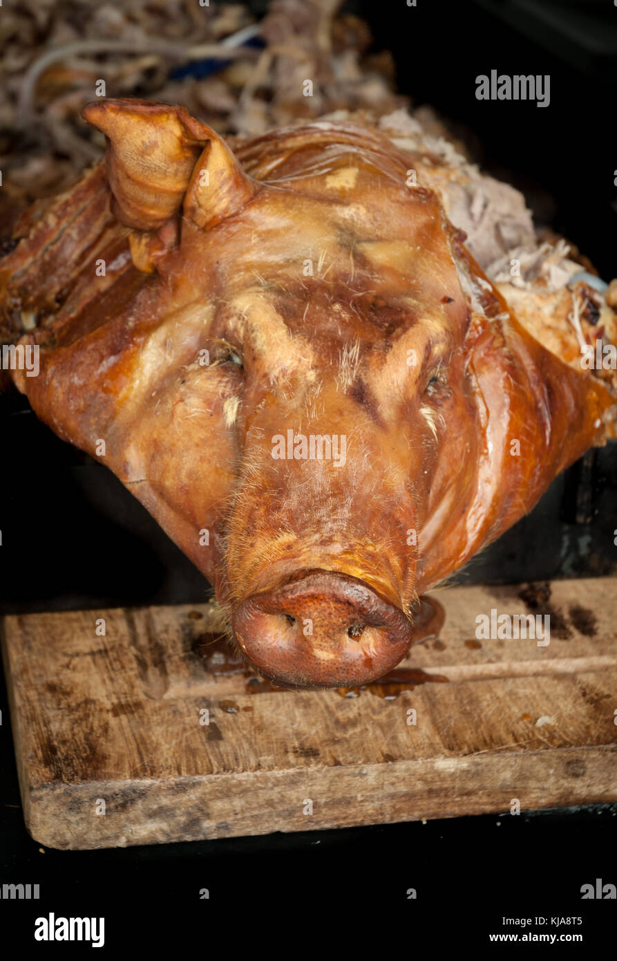 Spit roasted pig at a banquet. Stock Photo