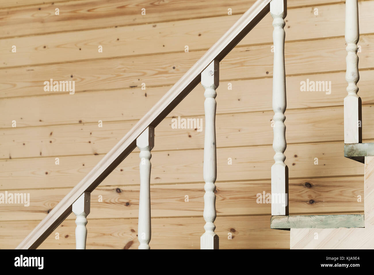 White balusters, stairway railings. Empty wooden house interior Stock