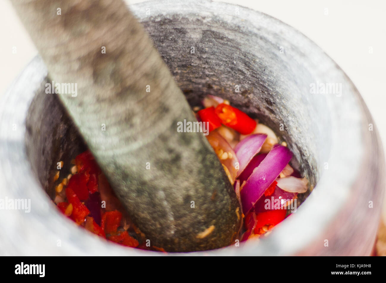 A Mortar And Pestle Or Lesung Batu In Malay With Crushed Chilies Fried Shallots And Shrimp Paste Mixed Together Soft Focus Shallow Depth Of Field Stock Photo Alamy
