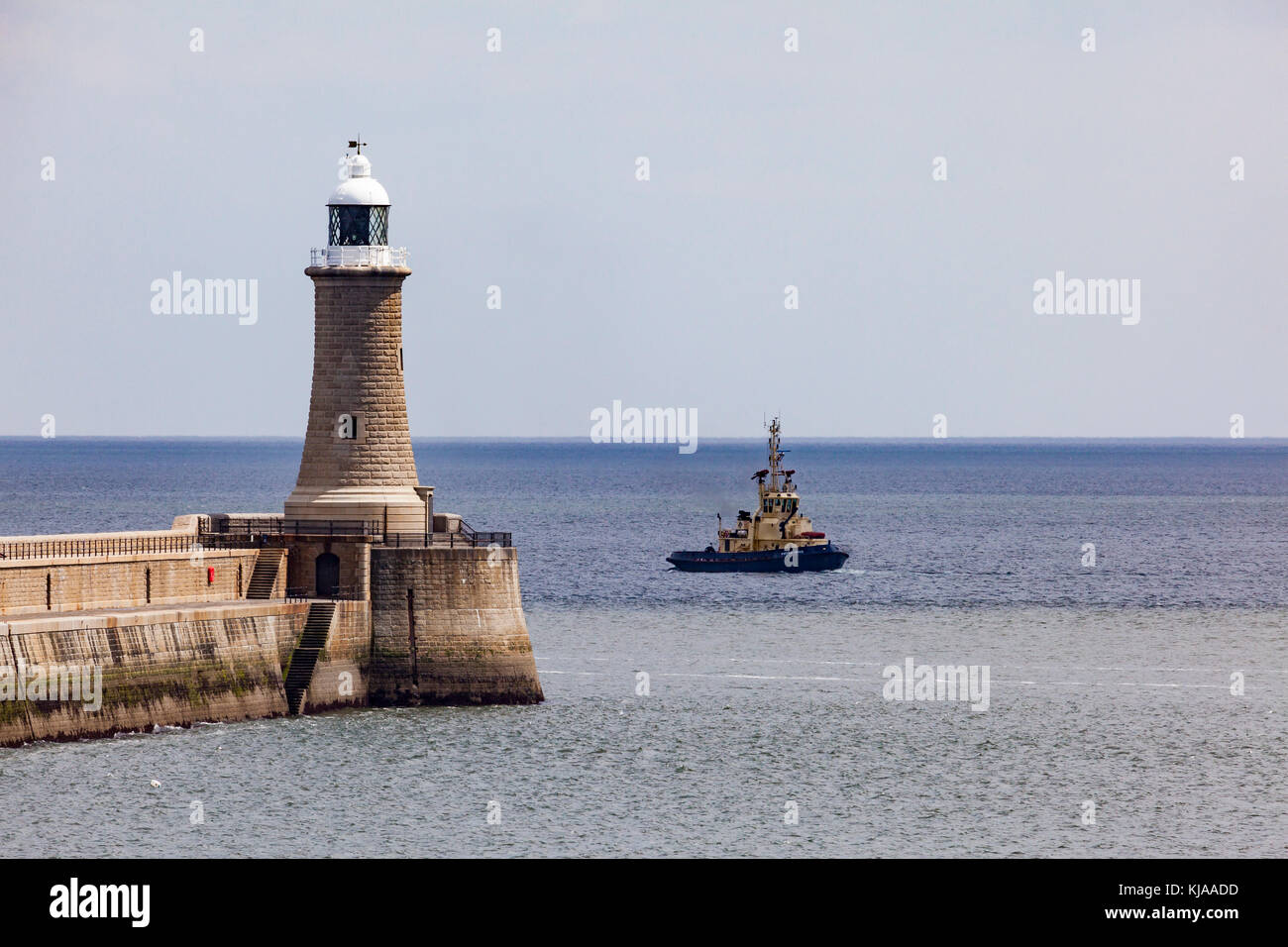 A tug waits in the Mouth of the River Tyne just off Tynemouth Pier