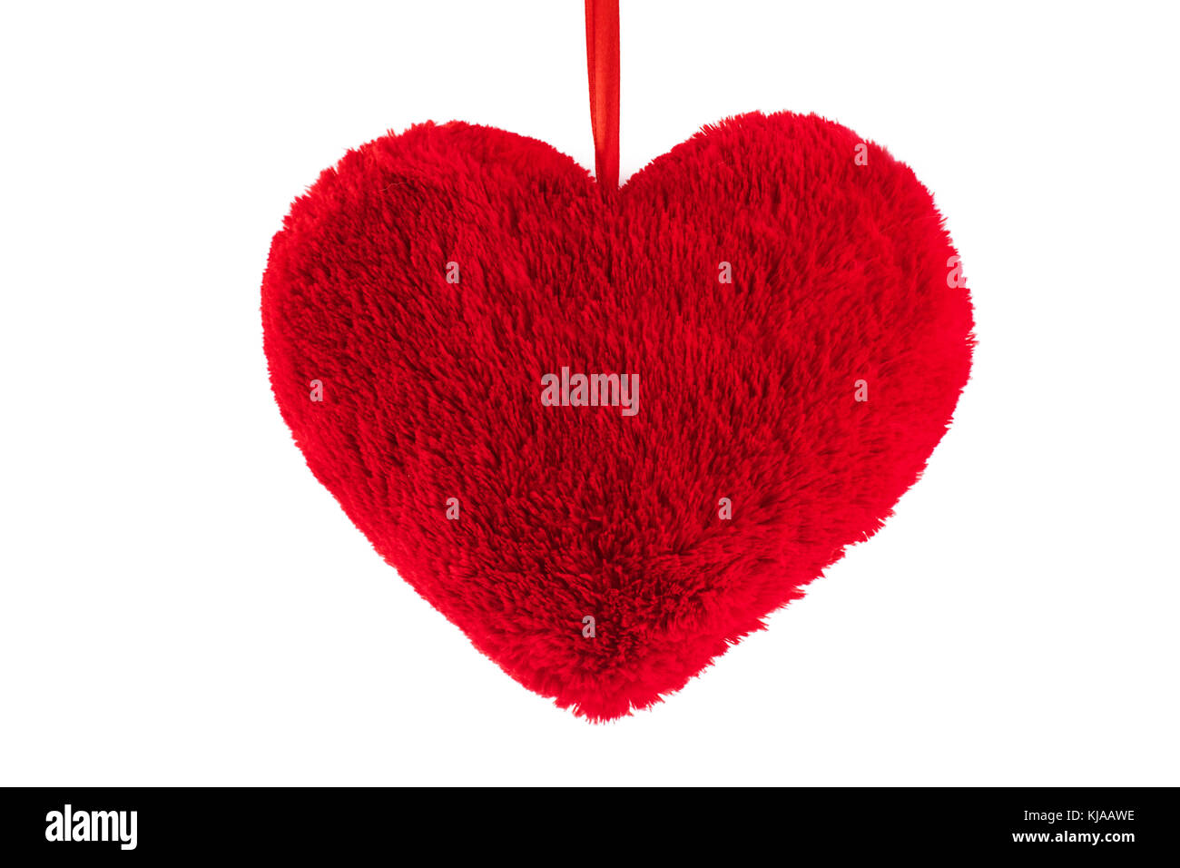 Plush red heart on white background. Stock Photo