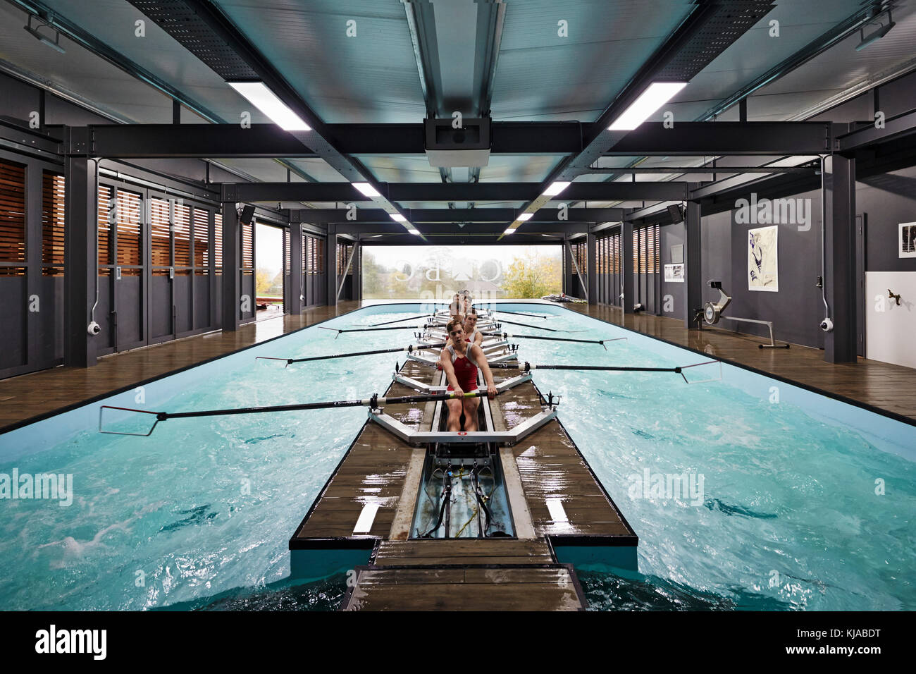Straight on view of students rowing. Radley Rowing Centre, Oxford, United Kingdom. Architect