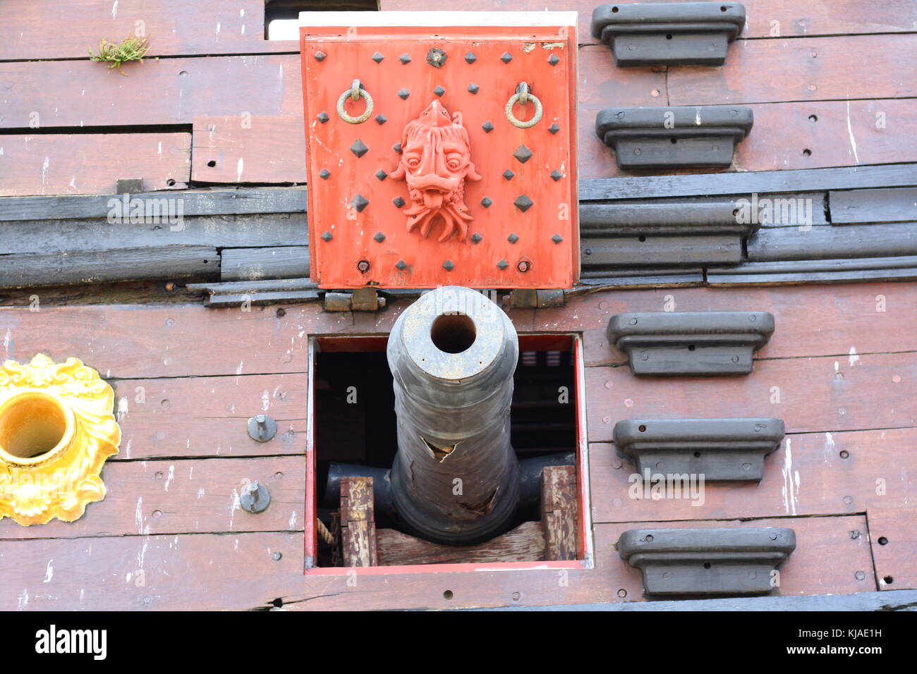 A cannon old classic wooden pirate sailing ship in the port of Genova ...