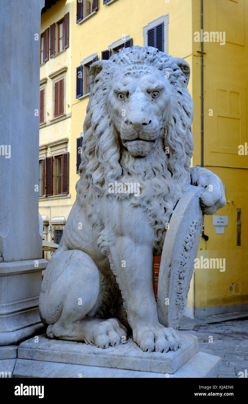 carved stone lion holding shield outside santa croce church, florence, italy Stock Photo