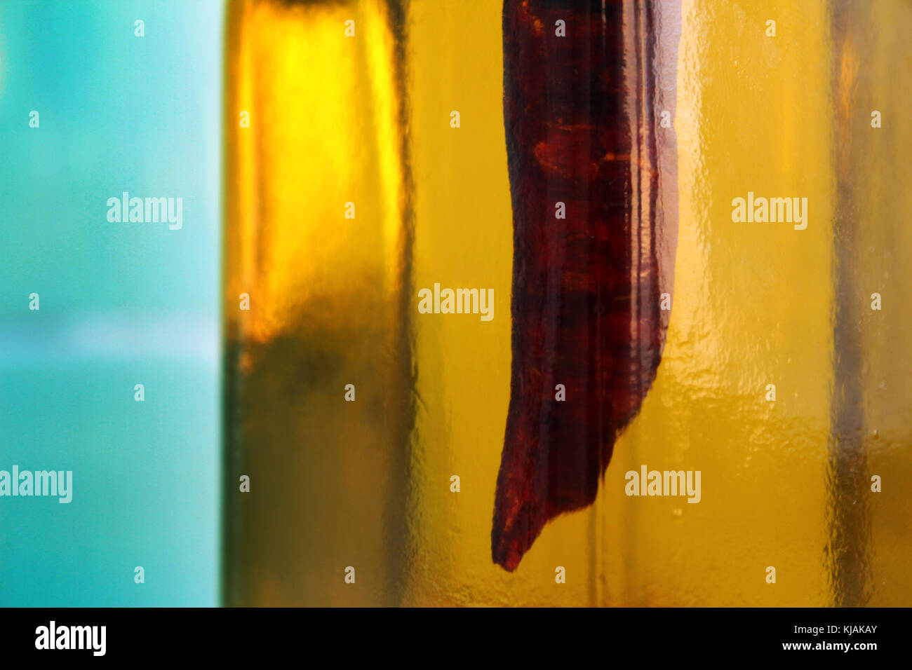 Olive oil bottle with chili peppers Stock Photo Alamy