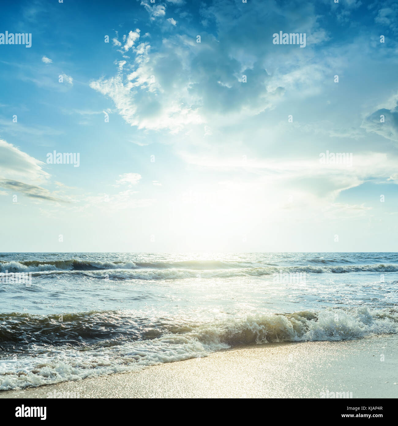 sea with waves and blue sky in sunset Stock Photo - Alamy