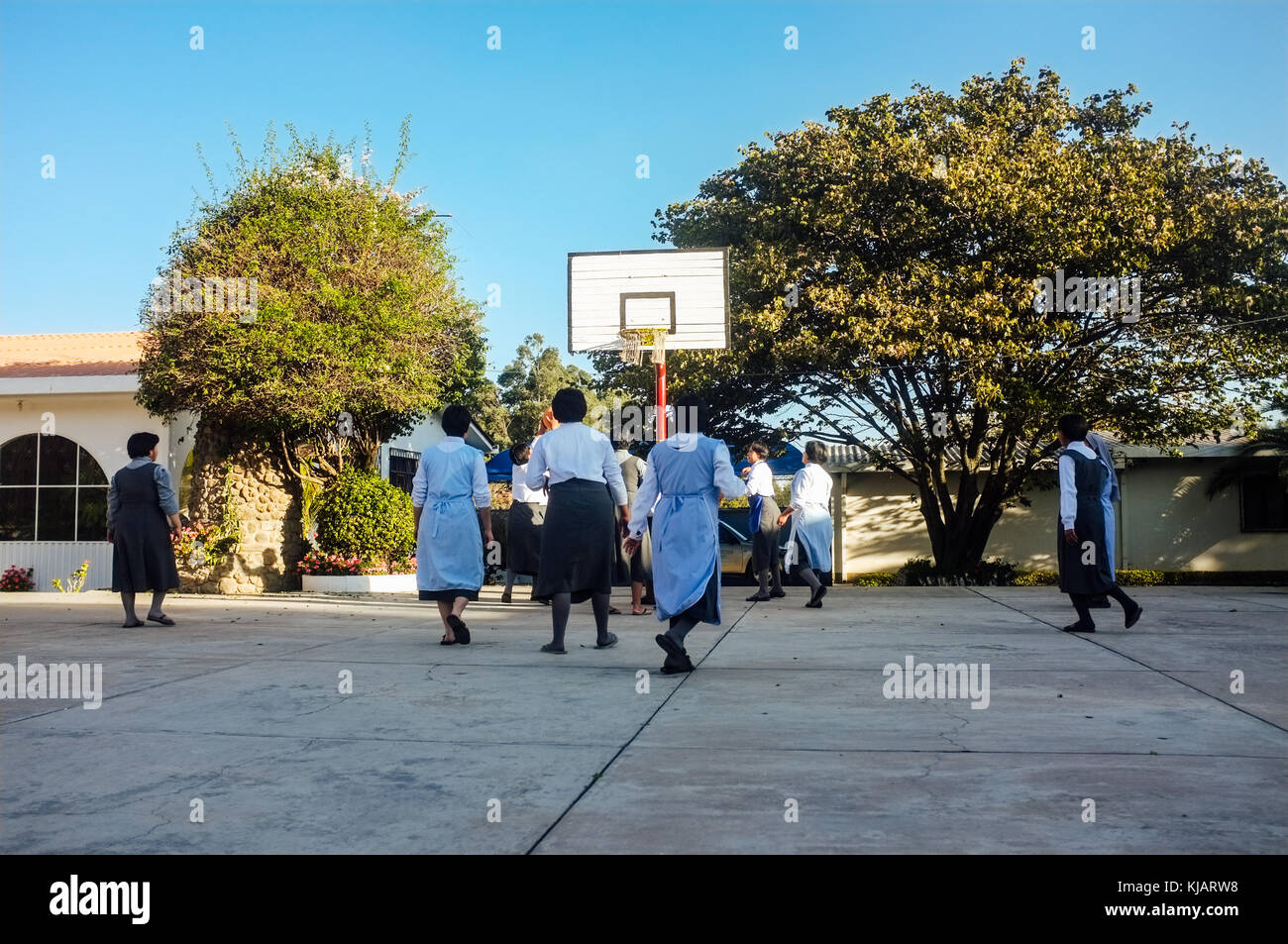 Adoption nuns playing basket outside. Oblate nuns order Mission. Cochabamba, Bolivia. Stock Photo
