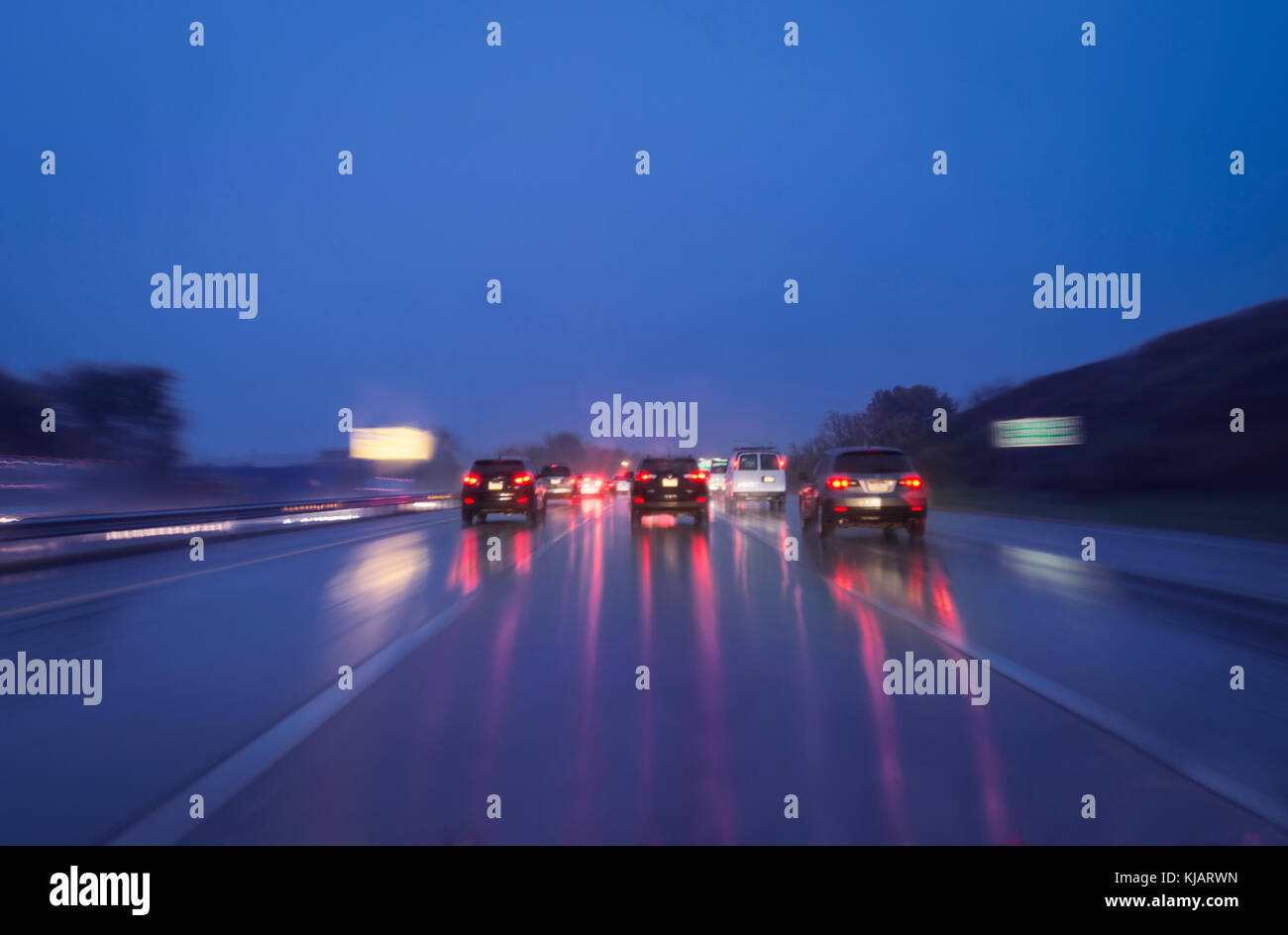 Cars On Highway In The Rain At Night Blurry Stock Photo