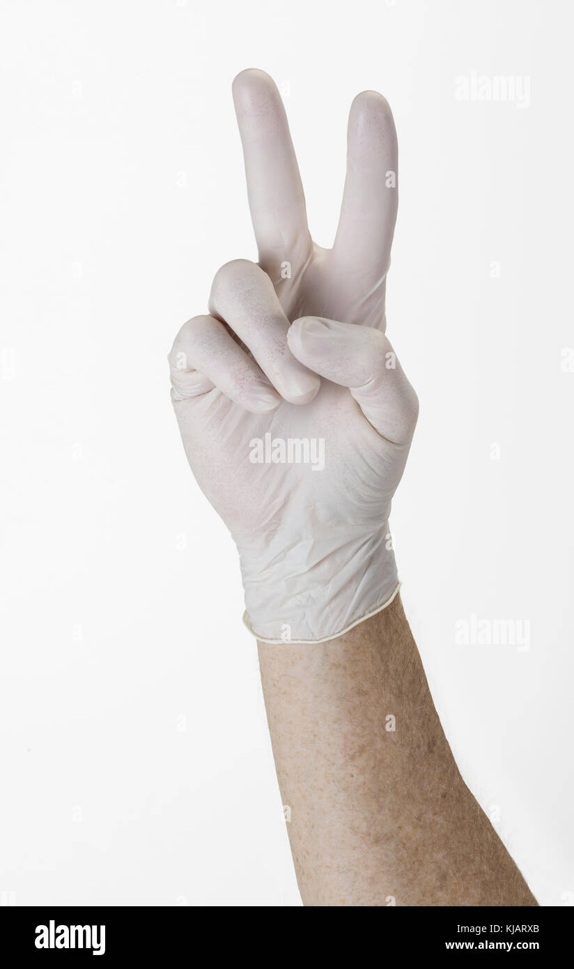 Gloved Glove Hand Making Peace Sign Or Number Two Stock Photo