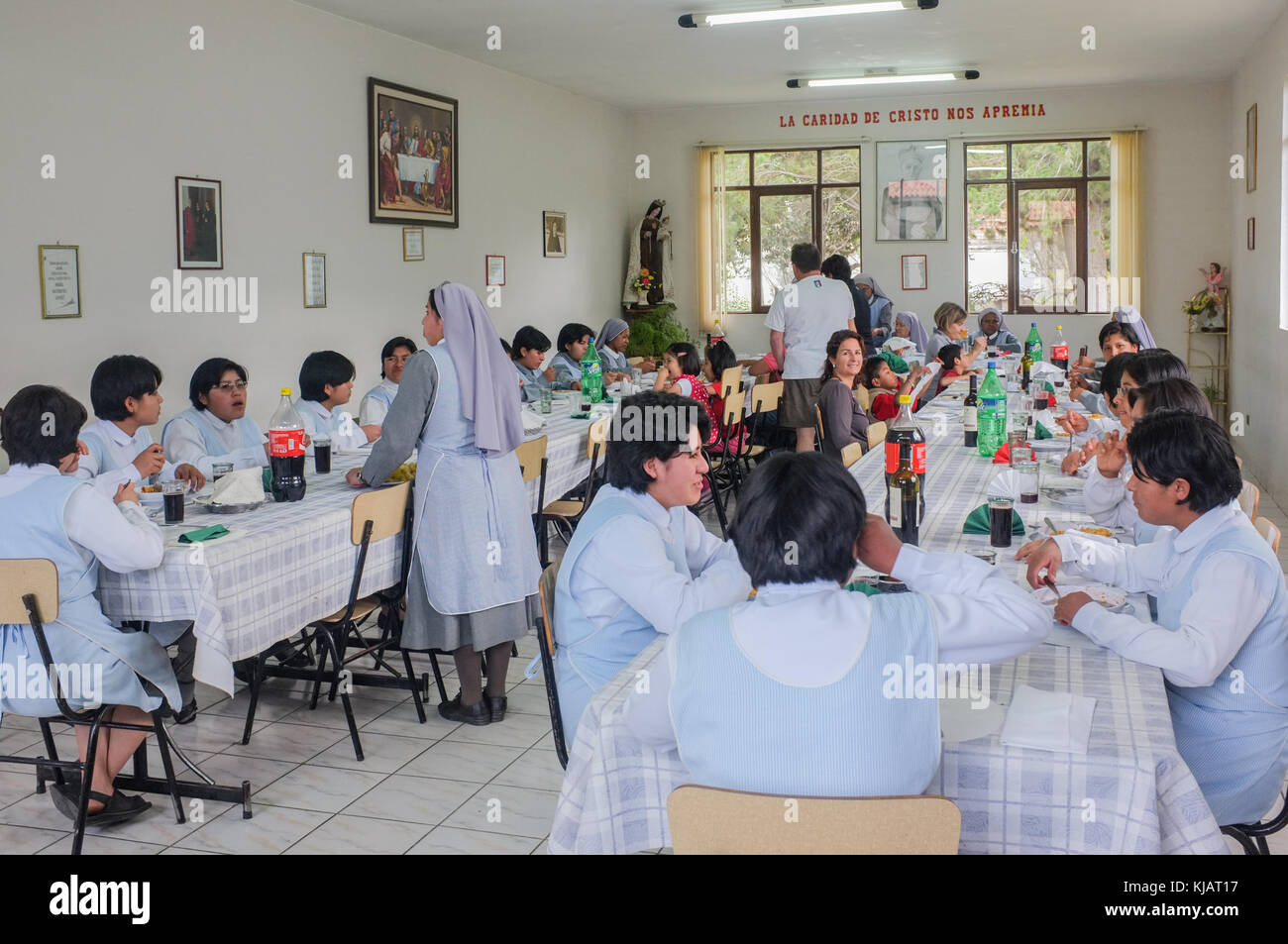 Nuns having lunch with international adoption families. Oblate nuns order Mission. Cochabamba, Bolivia. Stock Photo