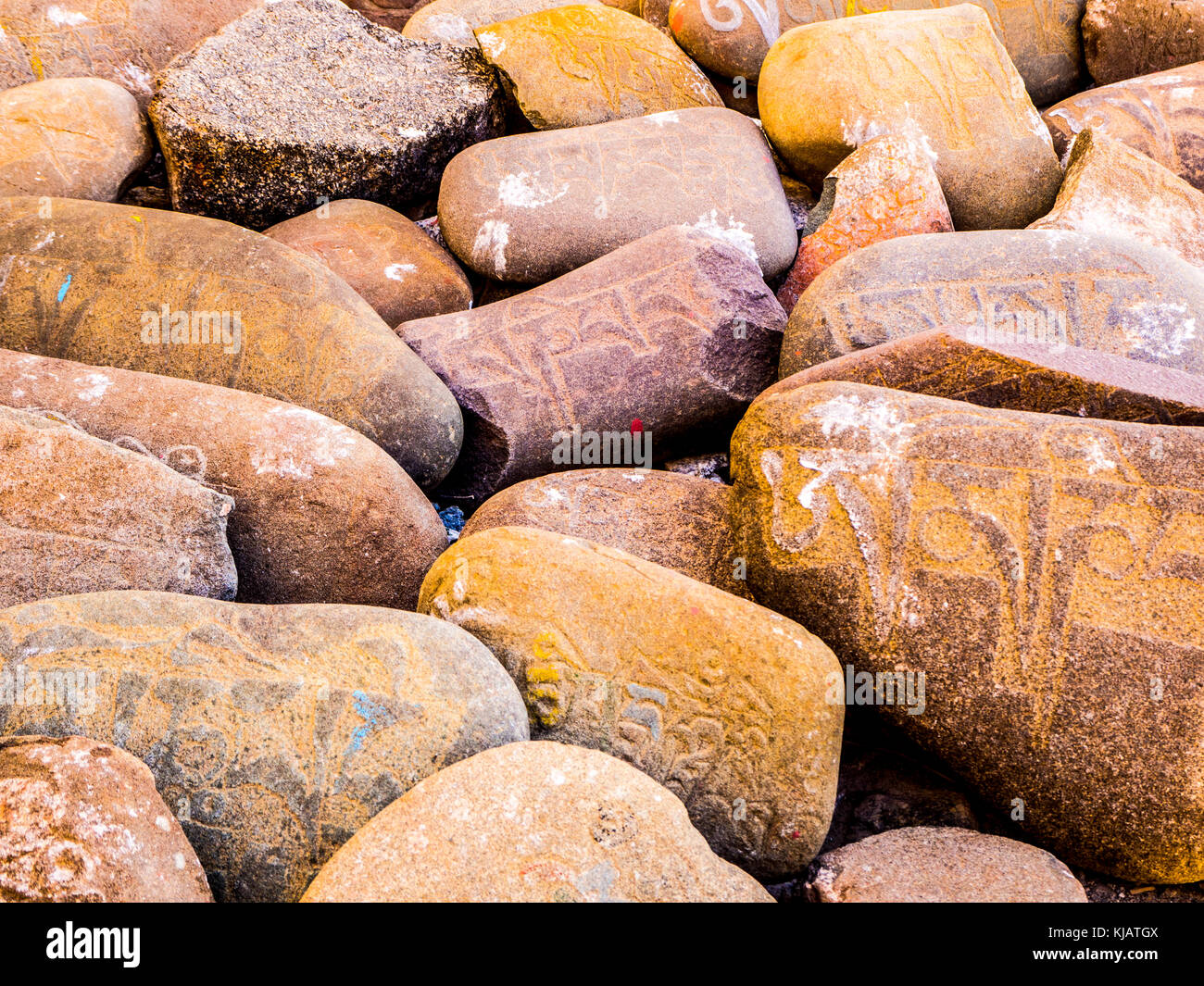 Om mani padme hum on stones - Ladakh India Stock Photo