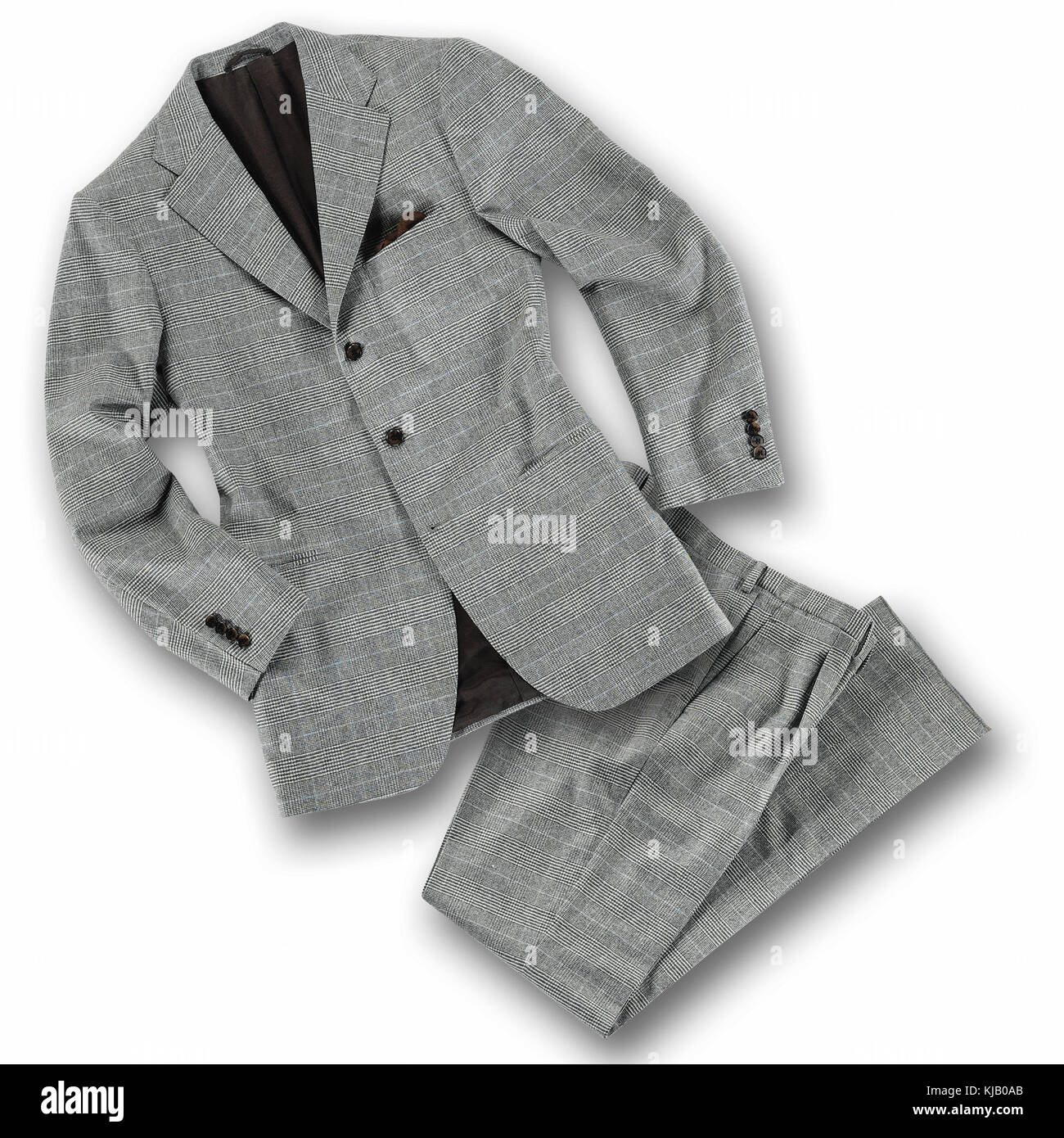 Elegant grey tailored suit with folded pants and jacket on white with shadow in a fashion concept Stock Photo
