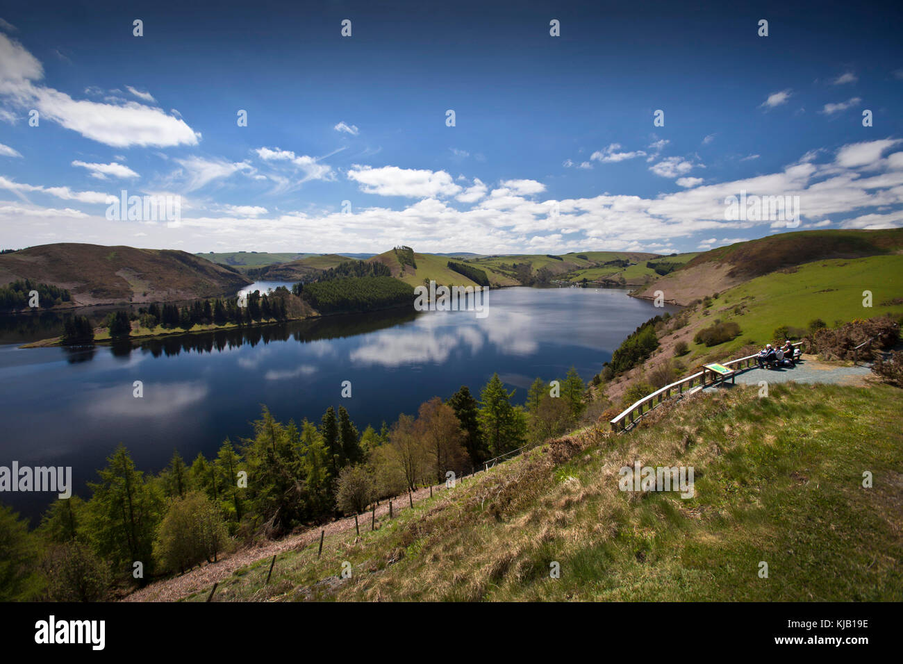 Viewpoint with visitors overlooking spectacular vista of Clywedog Reservoir, Wales, UK Stock Photo